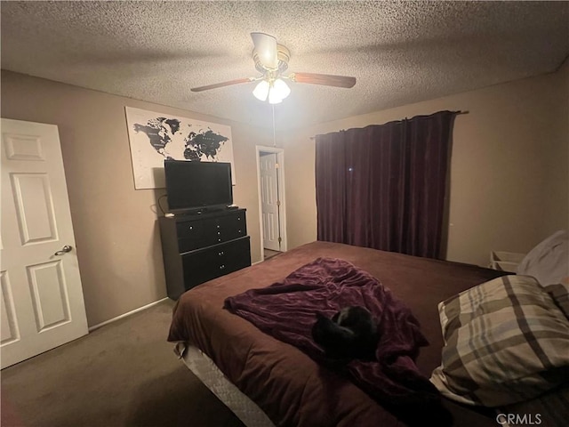 carpeted bedroom with ceiling fan and a textured ceiling