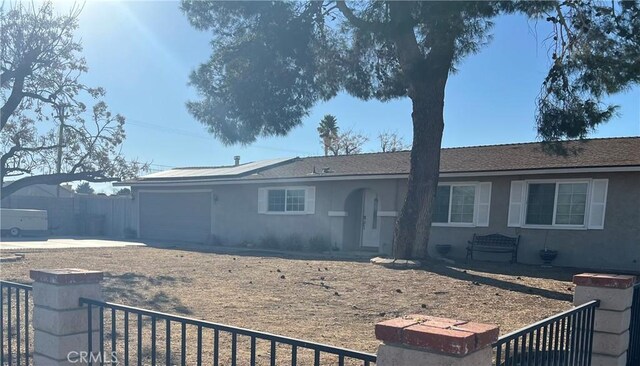 single story home with a garage