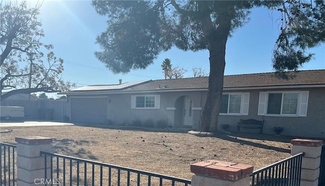 single story home featuring a garage