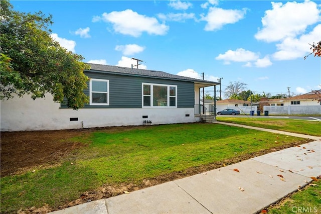 view of property exterior featuring a lawn