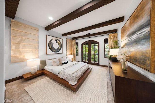 carpeted bedroom featuring access to exterior, beamed ceiling, and french doors