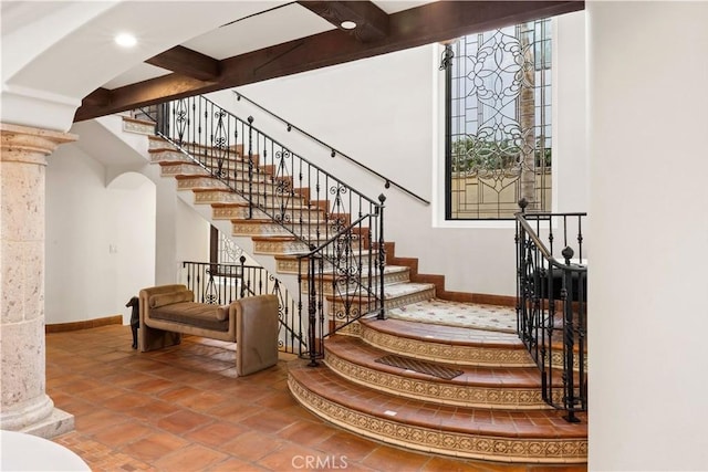 stairway with decorative columns