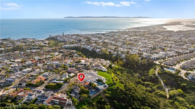 birds eye view of property featuring a water view and a view of the beach