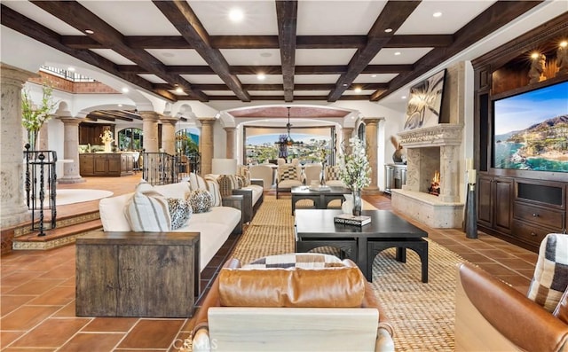 living room with a high end fireplace, ornate columns, beamed ceiling, and light tile patterned flooring