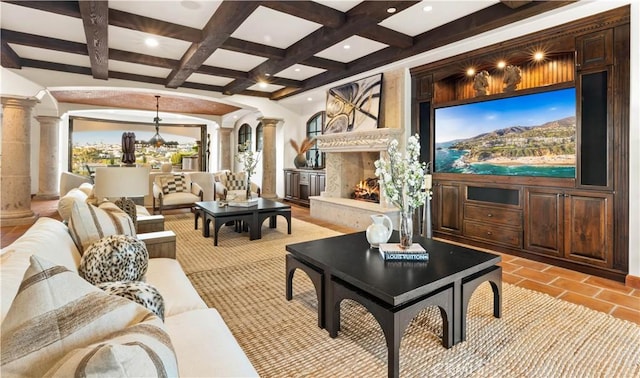 living room with a premium fireplace, beamed ceiling, coffered ceiling, light tile patterned floors, and ornate columns