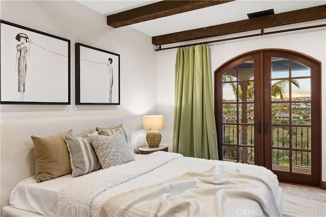 carpeted bedroom with access to exterior, beamed ceiling, and french doors