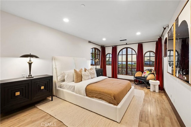 bedroom with light hardwood / wood-style floors