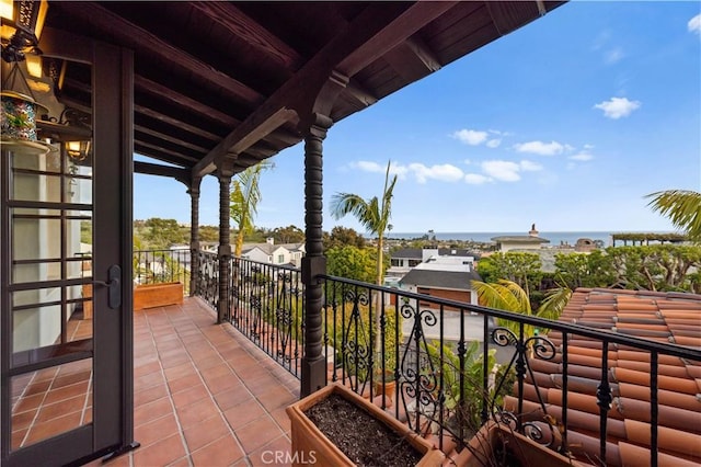 balcony featuring a water view