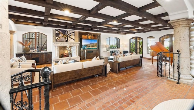 tiled living room with beam ceiling, coffered ceiling, and decorative columns