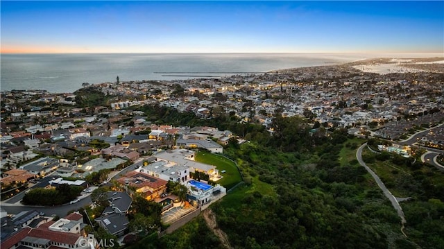 aerial view at dusk with a water view