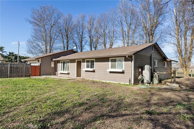 back of property with a yard