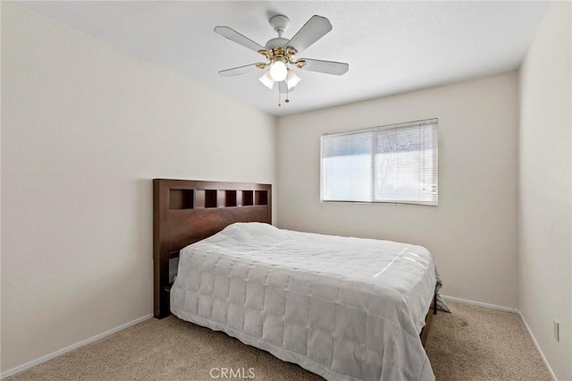 bedroom with light carpet and ceiling fan