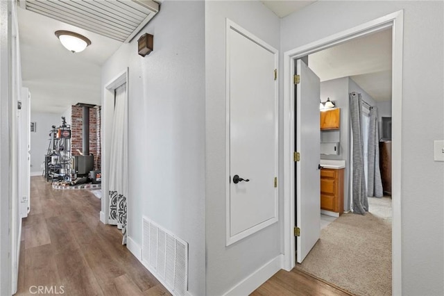 hall with light wood-type flooring