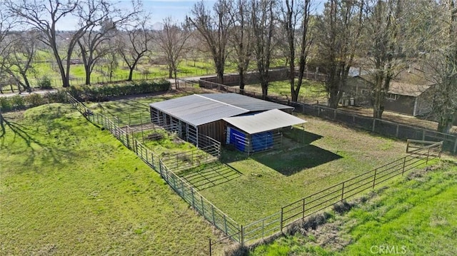 birds eye view of property with a rural view