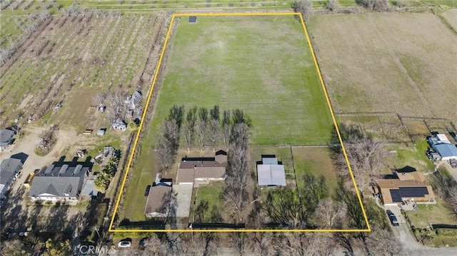 birds eye view of property featuring a rural view