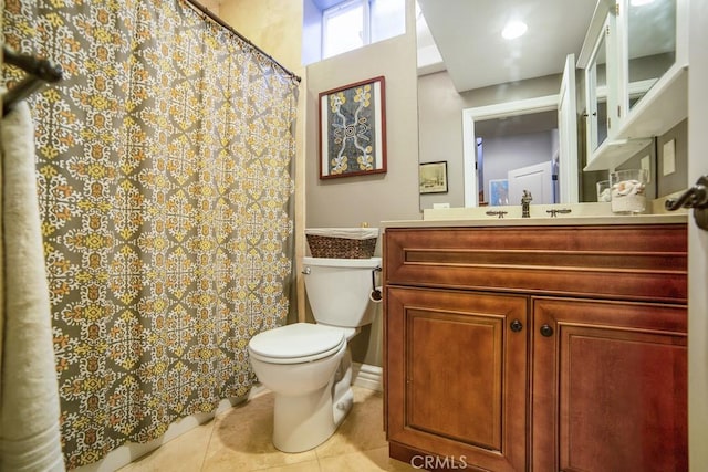 bathroom featuring vanity, toilet, and tile patterned floors