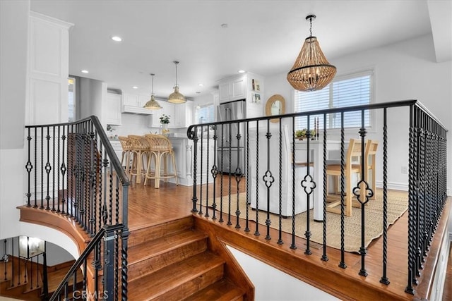 1612 Speyer Ln, Redondo Beach, CA 90278 - stairway featuring a chandelier, wood finished floors, healthy amount of natural light, and recessed lighting