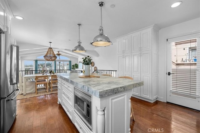 1612 Speyer Ln, Redondo Beach, CA 90278 - kitchen with appliances with stainless steel finishes, white cabinets, recessed lighting, dark wood finished floors, and hanging light fixtures