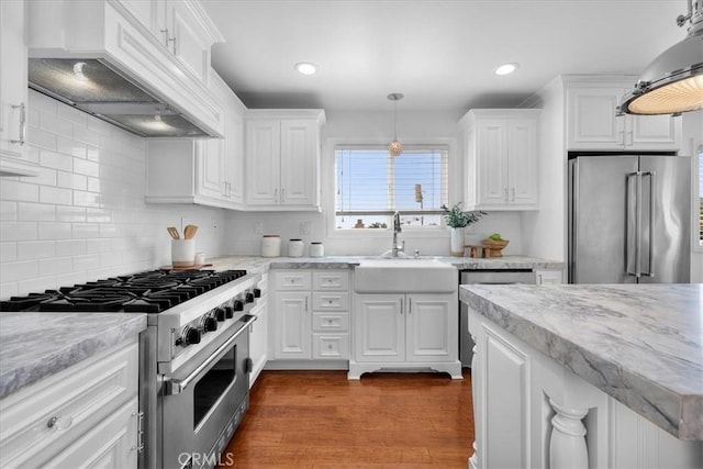 1612 Speyer Ln, Redondo Beach, CA 90278 - kitchen featuring stainless steel appliances, premium range hood, white cabinets, backsplash, and dark wood-style floors