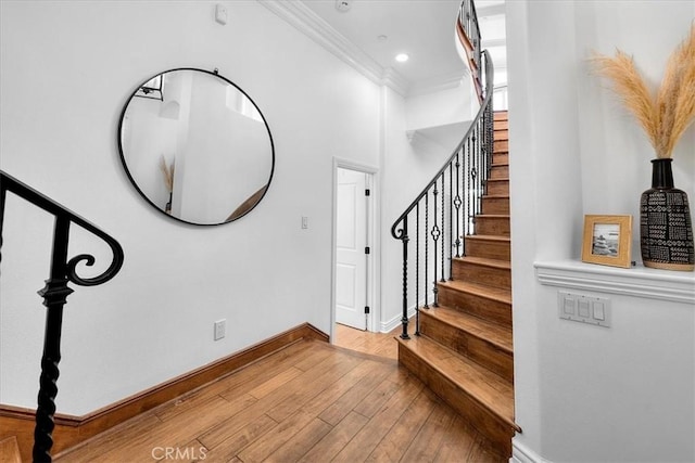1612 Speyer Ln, Redondo Beach, CA 90278 - stairway featuring ornamental molding, hardwood / wood-style flooring, and a towering ceiling
