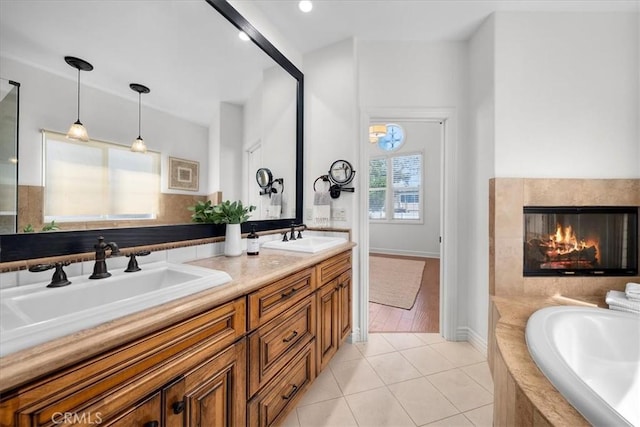 1612 Speyer Ln, Redondo Beach, CA 90278 - bathroom featuring double vanity, a garden tub, tile patterned flooring, and a premium fireplace