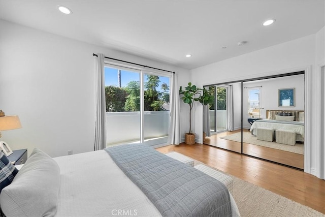 1612 Speyer Ln, Redondo Beach, CA 90278 - bedroom featuring multiple windows, wood finished floors, recessed lighting, and access to outside