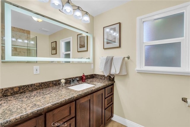 bathroom with a shower and vanity