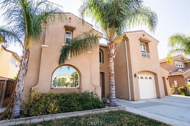 mediterranean / spanish house with a garage