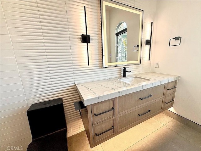 bathroom with tile patterned floors and vanity