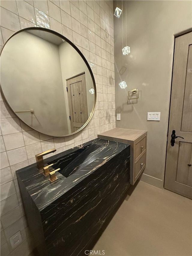 bathroom with tile walls, backsplash, and vanity