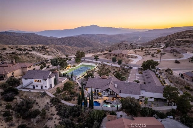 aerial view at dusk with a mountain view