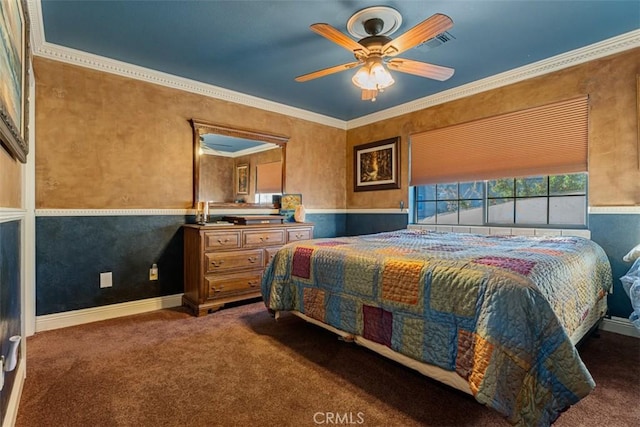 bedroom with ceiling fan, dark carpet, and crown molding