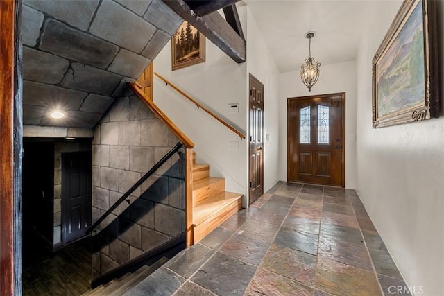 foyer with a chandelier