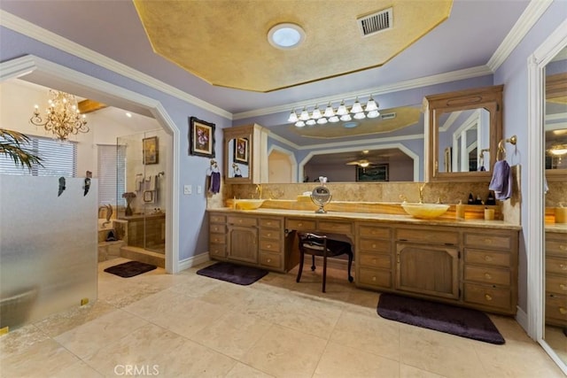 bathroom with tasteful backsplash, a notable chandelier, walk in shower, ornamental molding, and vanity