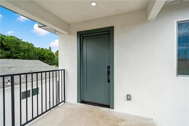 entrance to property with a balcony