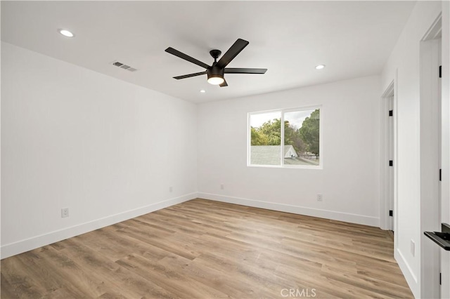 unfurnished bedroom with ceiling fan and light wood-type flooring