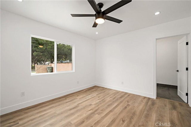 empty room featuring light hardwood / wood-style floors and ceiling fan