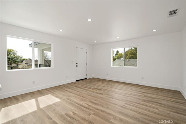 empty room with light wood-type flooring