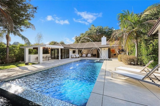 view of swimming pool with a patio