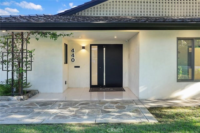 doorway to property with a patio area