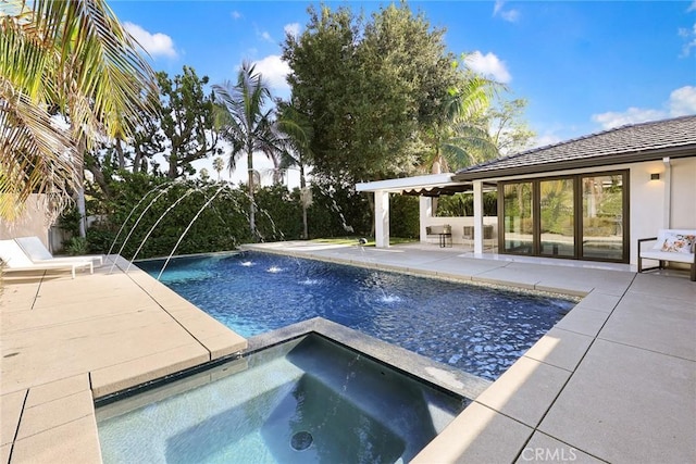 view of pool with an in ground hot tub, pool water feature, and a patio