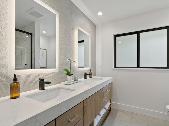 bathroom featuring an enclosed shower, vanity, backsplash, and toilet