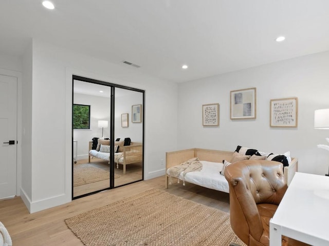 bedroom with a closet and light wood-type flooring