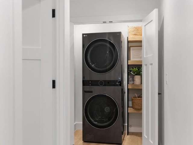 laundry area featuring stacked washer and clothes dryer