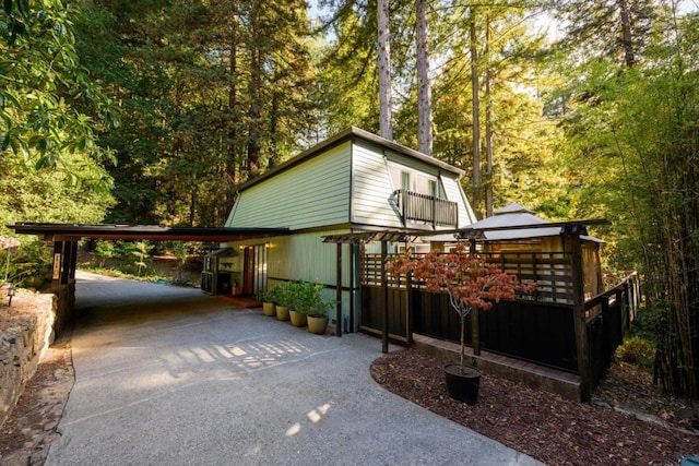 view of home's exterior featuring a carport