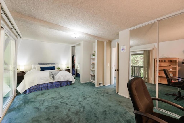 carpeted bedroom with a textured ceiling