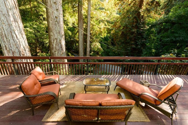 wooden deck with an outdoor living space