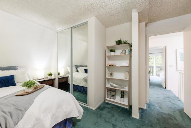 bedroom featuring dark carpet, a closet, and a textured ceiling