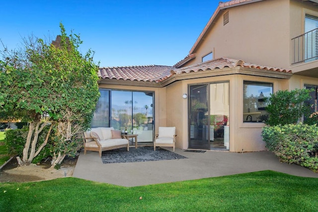 exterior space with a balcony and outdoor lounge area