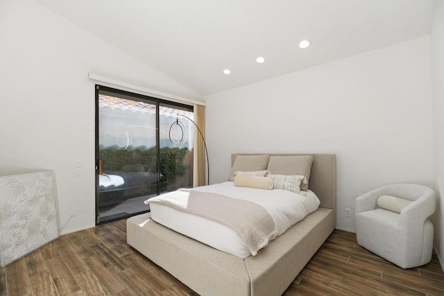 bedroom featuring lofted ceiling, dark hardwood / wood-style floors, and access to outside